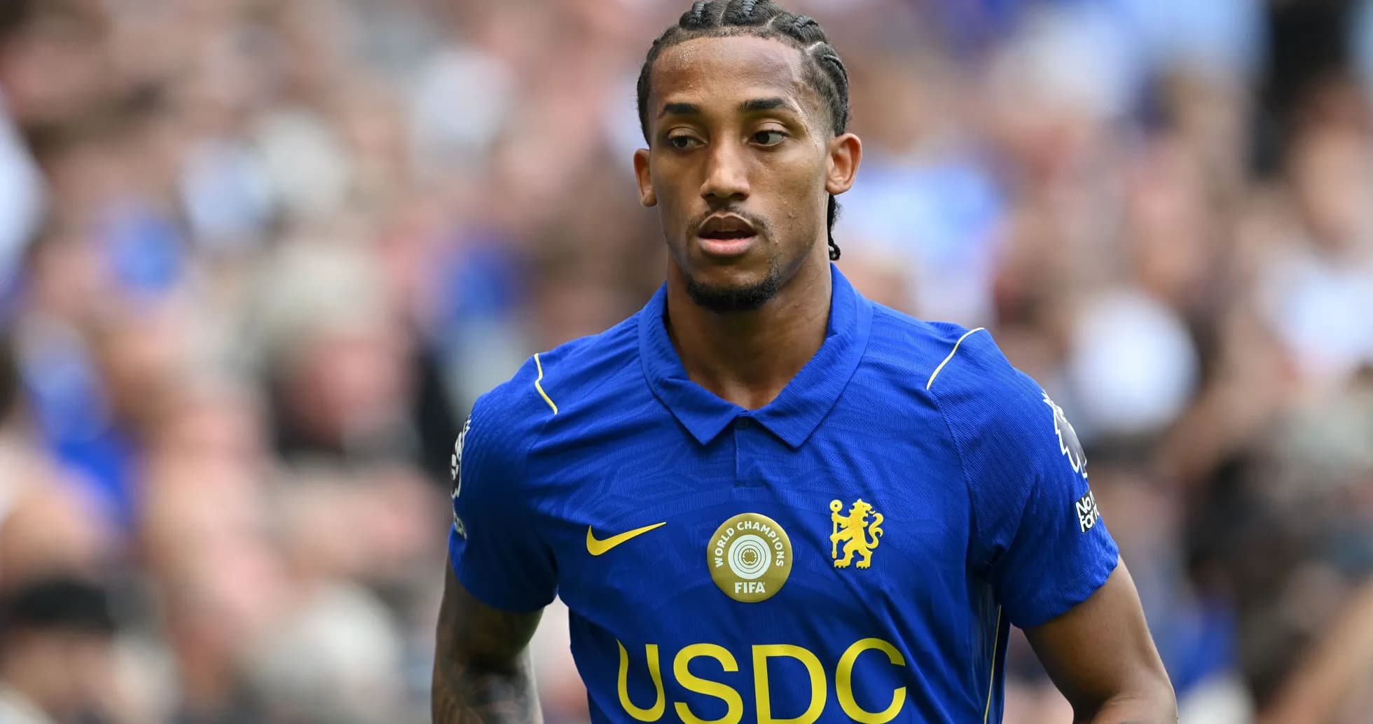 Player wearing Chelsea jersey on the pitch Player wearing Chelsea jersey on the pitch