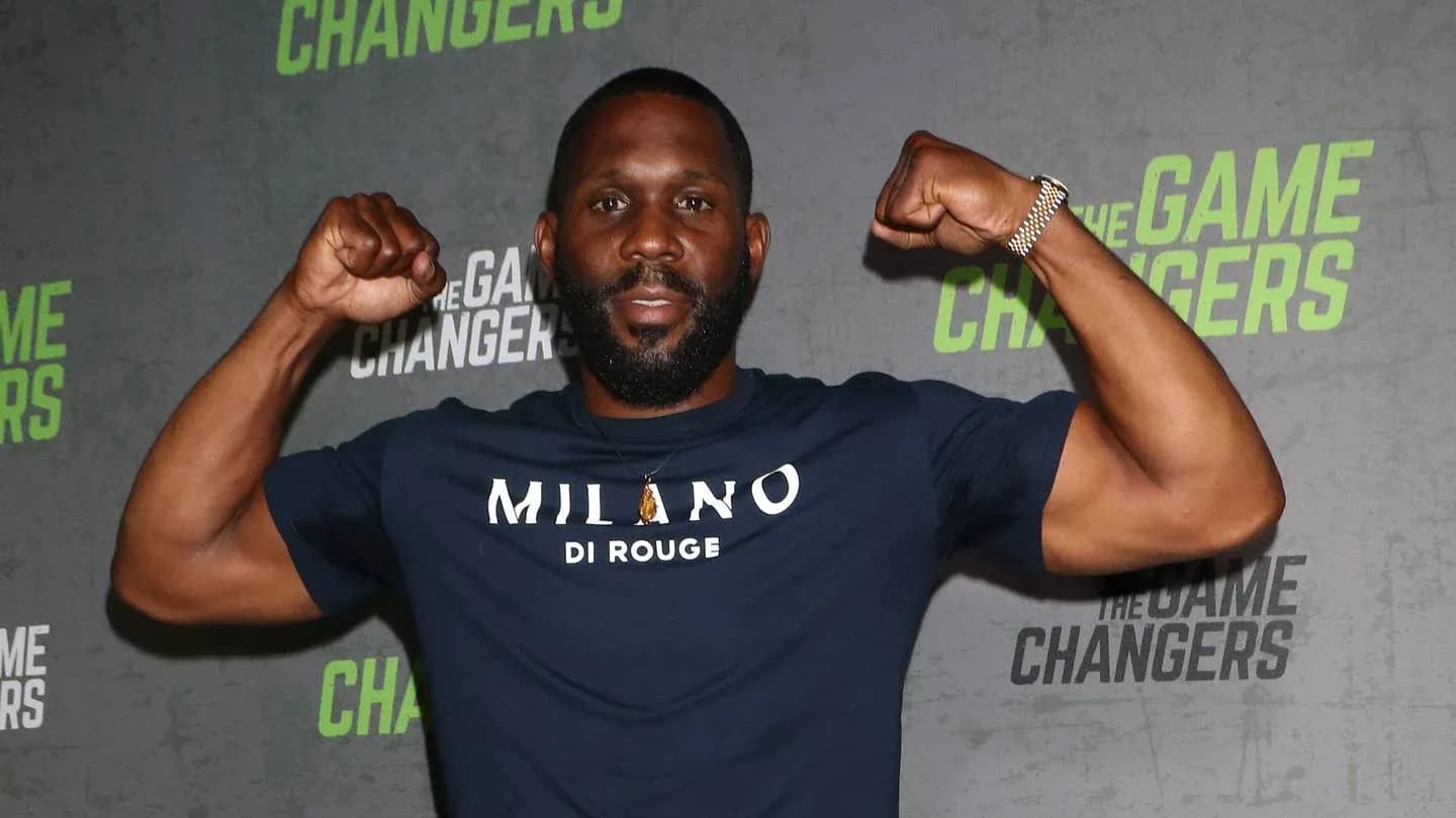 Man flexing muscles at promotional event Man flexing muscles at promotional event