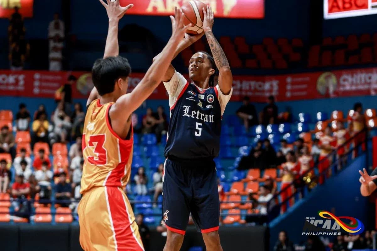 Player shooting a basketball during a game Player shooting a basketball during a game