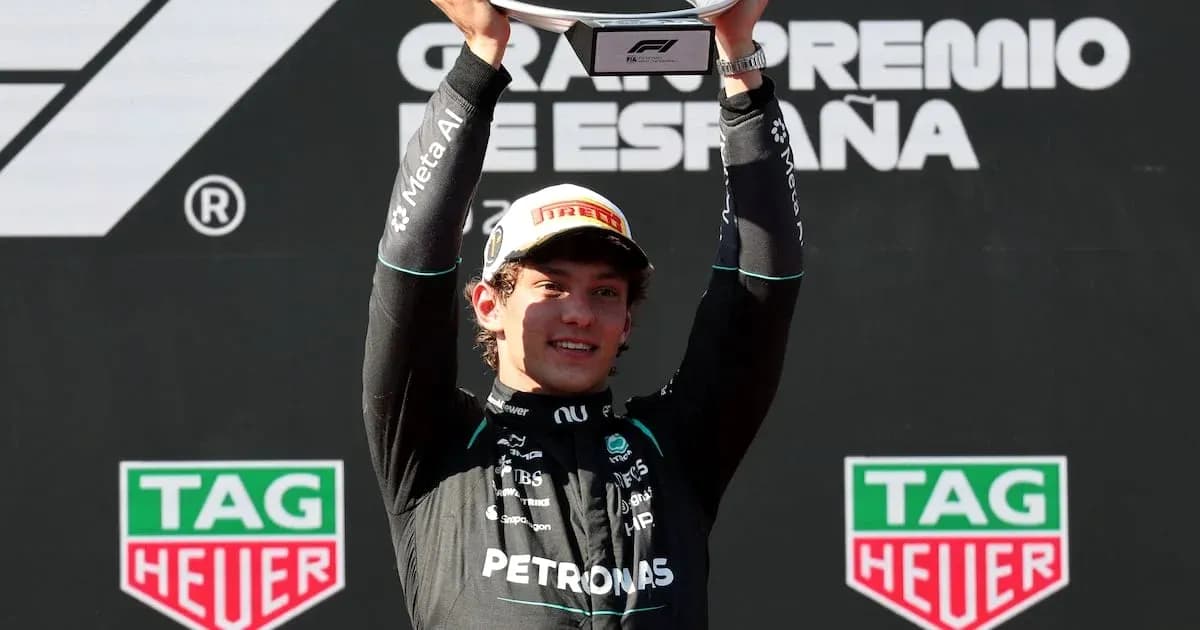Driver celebrating with trophy at Spanish Grand Prix Driver celebrating with trophy at Spanish Grand Prix
